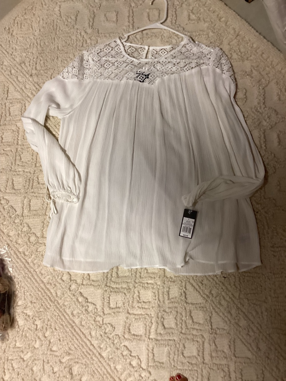 New with tags, white sheer blouse.